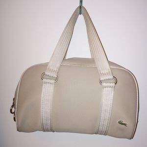 Nice vintage, preppy Cream/Beige Lacoste bowling handbag in good condition.